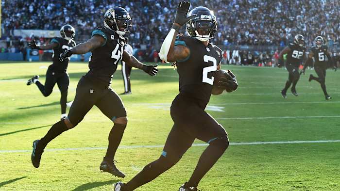Rayshawn Jenkins runs into the end zone with linebacker Josh Allen.